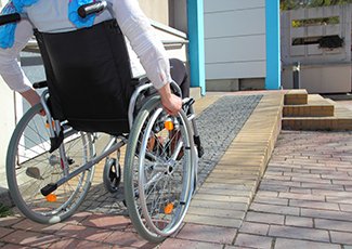 woman in wheelchair on ramp